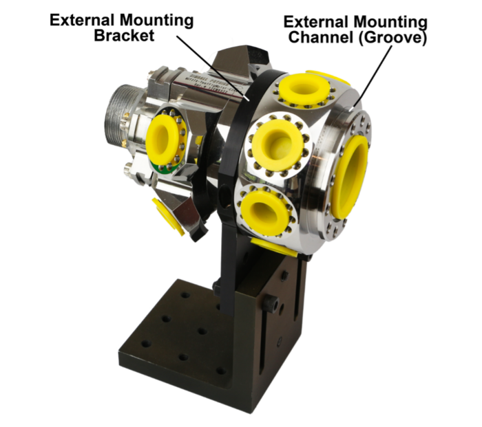 Figure 10. Spherical Octagon with bilateral mounting channels with External Mounting Bracket engaged.  Temporary port covers are in place to protect CF surfaces including their knife-edges.